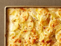 a casserole dish with potatoes and cheese