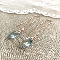 "Heatherly Designs simple and beautiful long dangling earrings made with teardrop Swarovski® crystals which dangle from delicate threader earrings. The metal is solid brass which has been plated in your choice of a precious metal finish. Shown in \"French Blue\" and the rose gold finish. ●Nickel free ●Size (L x W): 2.5\" x 3/8\" or 66 x 10mm ●Swarovski crystal color(s): Crystal Blue Shade ●Arrives in our signature Heatherly gift box. Handmade with ❤ by Heather ● ● ● ● ● ● ● ● ● ● ● ● ● ● ● ● ● ● Ribbon Necklaces, Gold Bridal Jewelry, Rose Gold Earrings Wedding, Rose Gold Bridal Jewelry, Blue Bridal Earrings, Chain Threader Earrings, Bridal Statement Earrings, Blue Crystal Earrings, Rose Gold Bridal