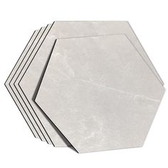 four white hexagonal plates stacked on top of each other with black lines in the middle