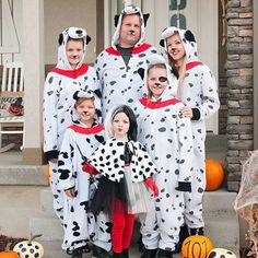 a family dressed up in dalmatian costumes