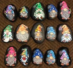 a group of painted rocks sitting on top of a carpet