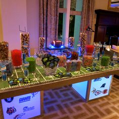 a football field table with candles and candy