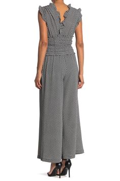 A ruffled V-neck crepe jumpsuit features a fun print for a classy, chic look.Fit: this style fits true to size. . Ruffled V-neck. Cap sleeves. Pull-on style. Side seam pockets. Gathered, smocked waist. Wide leg. Crinkled woven construction. Approx. 54" length, 24" inseam (size S). Imported Machine wash cold 96% polyester, 4% spandex Spring Sleeveless Ruched Jumpsuits And Rompers, Sleeveless Ruched Jumpsuits And Rompers For Spring, Sleeveless Jumpsuits And Rompers With Elastic Waistband For Work, Elegant Ruched Jumpsuits And Rompers For Spring, Chic Strapless Sleeveless Jumpsuit With Elastic Waistband, Elegant Romper With Smocked Back, Elegant Sleeveless Jumpsuit With Elastic Waistband, Crepe Jumpsuit, Classy Chic