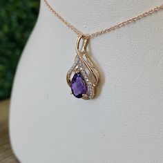 Metal: 14k Rose Gold Amethyst Gem: 1.12 CTW Side Diamonds: 0.05 CTW This gorgeous Amethyst necklace is set in rose gold and stationed on a 1mm rose gold chain. Elegant Rose Gold Amethyst Jewelry, Elegant Rose Gold Amethyst Necklace, Purple Teardrop Pendant Fine Necklace, Fine Jewelry Purple Teardrop Pendant Necklace, Formal Rose Gold Amethyst Necklace, Fine Jewelry Rose Gold Amethyst Necklace, Fine Jewelry Rose Gold Amethyst Necklaces, Rose Gold Amethyst Pendant Jewelry, Elegant Purple Necklaces With Diamond Accents