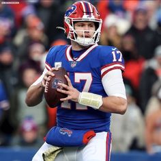 a football player holding a ball during a game