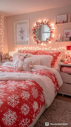 a bedroom decorated in pink and white with lights on the headboard, bedding and pillows