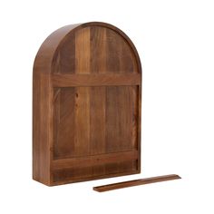 an arched wooden shelf with a piece of wood next to it