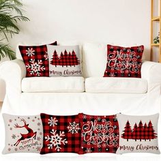 a white couch with christmas pillows on it