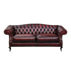 a red leather couch with black legs and buttons on the back, against a white background