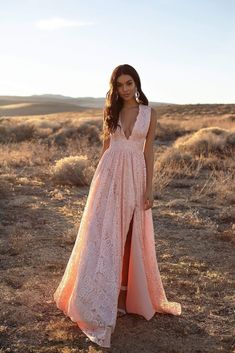 The new Genelle Lace Gown in peach is so dreamy. This gown features a plunge neckline, side slit & is made from gorgeous delicate lace fabric with scalloped edges. Genelle is fully lined & has minimal stretch. What is a Made-To-Order? This product is a made-to-order item. Made-to-order items are not held in physical stock and production commences AFTER order placement. We try to limit production and stock levels and as such, made-to-order items produce less waste and allow you to purchase your dream gown without the chance of it selling out. We suggest that you order well in advance for special occasions such as formal or weddings and take note of the estimated delivery date when placing your order. Production Policy Once production has commenced on your item and you wish to cancel, a prod Velvet Accessories, A Line Evening Dress, V Neck Prom Dresses, Lace Side, Boho Bridal, Glitz And Glam, Lace Gown, The Desert, White Fabrics