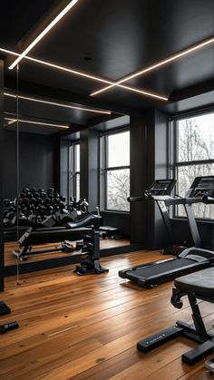 an empty gym with treadmills and exercise machines