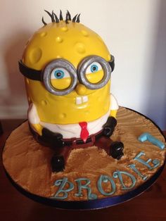 a cake that is decorated to look like a minion