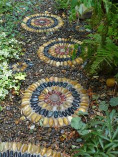 a garden path made out of rocks and pebbles