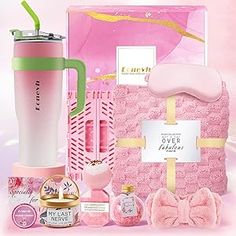 the contents of a pink gift set including a travel mug, hair brush, and other items