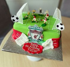 a cake with soccer themed frosting on it