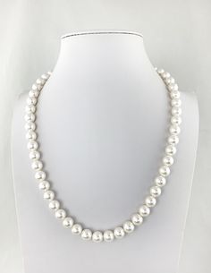 "Timeless elegance with a sleek modern twist! This strand of Mother of Pearls have a singular way of making virtually any ensemble seem just that little bit classier...a little more sophisticated. But, hang one...you don't want too much of that either. So how do you get the benefits of pearls while keeping the edginess of your carefully crafted contemporary aesthetic intact....by picking the right size, shape and color Alternative to real pearls at a quarter of the price, with the same classic e Classic Polished Beads Jewelry For Formal Occasions, Elegant Polished Beads Necklace, Elegant Round Beaded Necklaces With Polished Beads, Classic Pearl White Necklaces For Everyday, Elegant Polished Pearl Necklace For Anniversary, Classic Single Strand Sterling Silver Pearl Necklace, Classic Single Strand Pearl Necklace For Everyday, Minimalist Single Strand Pearl Necklace For Formal Occasions, Everyday Pearl White Single Strand Jewelry