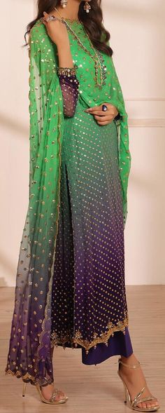 Product Description:  Signature kundan and crystal details on the neckline, sleeves, and hem complement the gold sequin work on a shaded foundation. matched with straight, raw silk pants and a sequined, scalloped chiffon dupatta. Fabric: Chiffon Color: Green Can be customized in any color Includes:  Shirt Pants Duppata Silk Palazzo Set With Sequins For Festivals, Designer Green Sequined Palazzo Set, Bollywood Silk Palazzo Set With Sequins, Festive Green Sequined Palazzo Set, Festive Green Palazzo Set With Sequins, Traditional Green Sequined Palazzo Set, Green Sequined Palazzo Set For Eid, Bollywood Style Sequined Palazzo Set, Bollywood Style Sequined Palazzo Set In Chinon