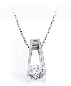 Diamond solitaire pendulum pendant in an elegant tension setting with a 0.62 ct. tw. round brilliant cut diamond. Graded as SI Clarity and G-H Color. Includes a free 16 inch gold chain. Handcrafted in 14k White Gold setting. We also offer a 1-Year Layaway program. You can reach us at 1-888-967-5353 to speak to one of our jewelry specialist. Solitaire Diamond Pendant, Solitaire Diamond, Solitaire Pendant, Conflict Free Diamonds, Round Brilliant Cut Diamond, Diamond Solitaire, Brilliant Cut Diamond, Diamond Pendant, Round Brilliant