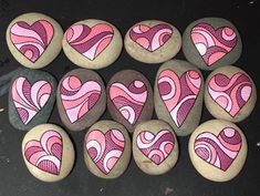 some rocks with hearts painted on them