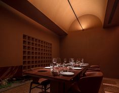 a long table with wine glasses on it