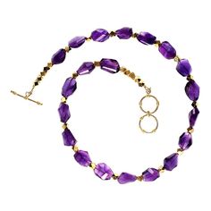 This is part of Chairish’s Fine Jewelry assortment.  Gorgeous, purple glowing amethyst polished chunks necklace with goldy accents.  Each of these polished chunks is a unique size and shape.  The necklace is secured by a two-ring gold plated toggle clasp. Toggle Clasp, Gold Rings, Gold Plate, Amethyst, Fine Jewelry, Plating, Purple, Gold