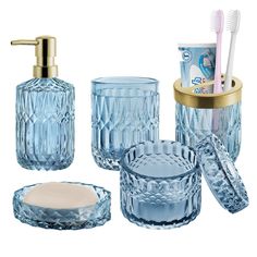 an assortment of bathroom accessories including toothbrushes and soap dispenser