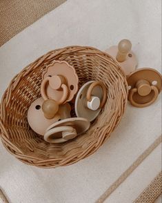 a basket filled with baby toys on top of a table