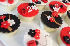 cupcakes decorated with red and black decorations