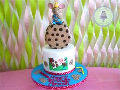 a birthday cake with a mouse on top