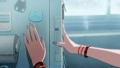 two hands reaching into a refrigerator door