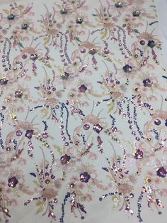 We offer a variety of fashion handmade fabric，those are widely use for wedding dress，garment and fashion cloth. we sell it by yard，our minimum order is 1 yards，and we always package it 15 yards for one roll，the width is 125cm/47 inch Material ： mesh ，Rayon,polyester. Symmetrical embroidery floral pattern, with lovely flowers in the middle, scalloped border. You can also cut and use separately. Perfect for dress, tops, wedding veil. You can split the piece up and have one scalloped edge around th Elegant Pink Sequin Fabric With Floral Embroidery, Multicolor Sequin Fabric For Spring Wedding, Spring Multicolor Sequin Fabric For Weddings, Pink Floral Embroidered Sequin Fabric For Spring, Spring Pink Sequin Fabric With Floral Embroidery, Elegant Pink Sequin Fabric For Summer, Pink Floral Print Embroidered Fabric For Party, Pink Sequin Fabric With Floral Embroidery For Spring, Pink Embroidered Floral Fabric For Party