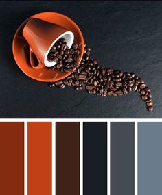 an orange coffee cup filled with coffee beans on top of a black table next to color swatches