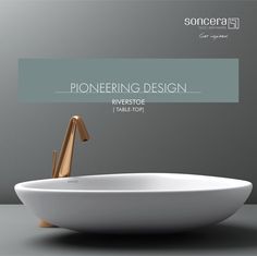 a white sink with gold faucet on it and the words pioneers design above it