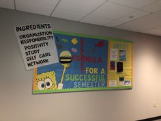 a bulletin board on the wall in an office