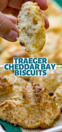 a close up of food on a plate with the words traeger cheddar bay biscuits