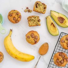 muffins, banana and avocado on a cooling rack next to each other