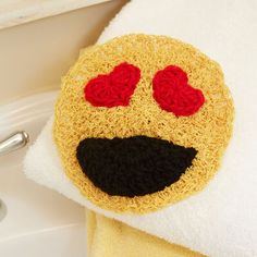 a close up of a towel with a face on it