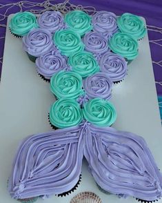 cupcakes are arranged in the shape of a mermaid tail