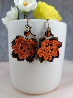 Micro-crocheted Sakura floral earrings in orange spice and beige brown are perfect for fall. Assembled with dark orange beads and antique copper-toned nickel-free findings. These stylish earrings for everyday wear are very lightweight.  Suitable for different occasions. Cute and cozy, they will make you stand out even in a formal dress. Aprox. 2" in drop length. Made to order. If there are any questions, please feel free to contact me. As a handmade item, slight variation is a special part of ea Bohemian Brown Flower Jewelry, Bohemian Brown Flower Earrings, Handmade Brown Bohemian Flower Earrings, Handmade Brown Flower Jewelry, Earthy Brown Copper Earrings, Handmade Brown Beaded Earrings, Handmade Orange Copper Earrings, Vintage Brown Flower Earrings, Brown Flower Earrings With Ear Wire