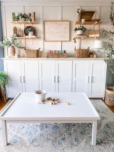 a white coffee table sitting on top of a rug