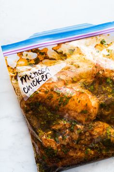 mexican chicken marinade in a plastic bag on a white counter top with text overlay