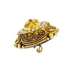 This stunning antique Victorian brooch is a true masterpiece of jewelry design. It is made of 14kt yellow gold, which gives it a warm, golden glow. The brooch features a locket compartment on the back that is adorned with numerous pearls and a small turquoise cab, which adds a pop of vibrant blue to the piece. The intricate design of the brooch is created in an elaborate Etruscan style, with applied gold beads and twisted wire applique, which is a classic Victorian ornamentation. The brooch is a Antique Yellow Gold Brooches With Intricate Design, Ornate Yellow Gold Brooch For Ceremonial Use, Ornate Yellow Gold Brooches For Ceremonial Use, Ornate Yellow Gold Brooches For Ceremonial Occasions, Victorian Gold Brooch With Locket, Victorian Gold Locket Brooches, Antique Yellow Gold Filigree Brooches, Ornate Gold Locket Brooches, Gold Locket Brooch For Collectors