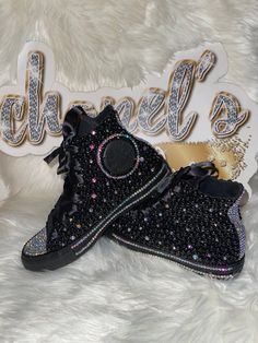 Custom Bling Converse All Star Chuck Taylor Sneakers. All designs handmade and embellished with a variety of high quality crystals. Great for weddings, proms, homecomings, birthdays, special events or just your everyday girly girl. **IF YOU NEED THIS ITEM BEFORE THE PROJECTED SHIPPING TIME YOU MUST CONTACT US BEFORE ORDERING (additional charges may apply) ** Shoe Details: Classic black on black high top Converse All Star Chuck Taylor Sneaker (cloth material style) Shoe Size: WOMEN'S size 5 to si High-top Rhinestone Sneakers For Streetwear, Bedazzled Shoes Black, Party Sneakers Embellished Black, Luxury Black Sneakers With Rhinestones, Converse Blinged Out, Black Bedazzled Converse, Bedazzled Converse, Custom Chuck Taylors, Black High Top Converse