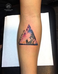 a person with a tattoo on their leg and the words, we are all in this triangle