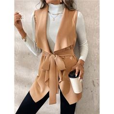 -Item Id 39056209 -Details: Belted -Neckline: Waterfall -Style: Casual -Type: Vest -Hem Shaped: Asymmetrical -Color: Khaki -Pattern Type: Plain -Sleeve Length: Sleeveless -Fit Type: Regular Fit -Length: Regular -Material: Knitted Fabric -Composition: 95% Polyester, 5% Elastane -Care Instructions: Hand Wash,Do Not Dry Clean -Sheer: No -Fabric: Medium Stretch -Body: Unlined -Pockets: No -Temperature: Spring/Fall (18-25/63-77) **Open To Offers!!!** **Bundle To Save More** **30% Off Bundles Of 2 Or Fall Vest With Pockets, Office Vest With Pockets For Fall, Trendy Winter Vest For Workwear, Trendy Winter Workwear Vest, Beige V-neck Outerwear For Layering, Brown V-neck Outerwear For Spring, Fitted Brown Outerwear With V-neck, Spring Office Cardigan In Solid Color, Brown Fitted V-neck Outerwear