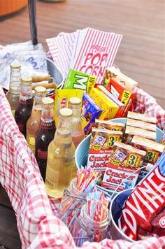 a picnic basket filled with snacks and drinks