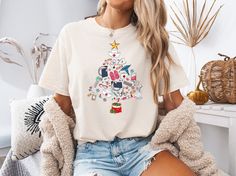 Celebrate the holiday season with our charming Nurse Christmas T-shirt, the perfect blend of festive spirit and heartfelt appreciation for those in the nursing profession. This cute Christmas shirt features an adorable design specifically crafted for RNs, featuring elements that any ICU Christmas nurse or NICU Christmas nurse would love! ️ Whether you're an ER nurse or working in the NICU, our T-shirt brings joy to the workplace and celebrates the spirit of giving and caring that defines nursing. It's not just a shirt; it's a thoughtful nurse Christmas gift that showcases your passion for your profession. Perfect for the oncology nurse, PICU nurse, or PEDS nurse, our stylish and comfortable design ensures that you shine during the holidays. 💖 Make a statement this Christmas season with ou Nurse Christmas Tree, Peds Nurse, Oncology Nurse, Christmas Gifts For Nurses, Picu Nurse, Cute Christmas Shirt, Nursing Shirt, Nursing Profession, Cute Christmas Shirts