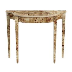 a marble topped console table with two legs and an oval shaped design on the top