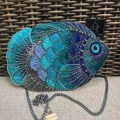 a blue fish purse sitting on top of a table