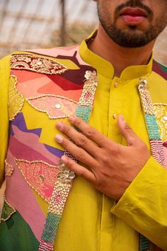 Multi colored bundi with abstract floral prints highlighted with beads, sequins and stone work embroidery. Comes with neonish yellow kurta and pant. - Aza Fashions Stylish Indian Outfits, Kurta Koti, Stone Work Embroidery, Kurta Designs Men's, Multi Colored Outfit, Stylish Boy Clothes, Wedding Kurta, Fancy Embroidery